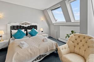 Łóżko lub łóżka w pokoju w obiekcie Hotel George Vienna