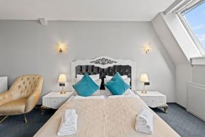 Łóżko lub łóżka w pokoju w obiekcie Hotel George Vienna