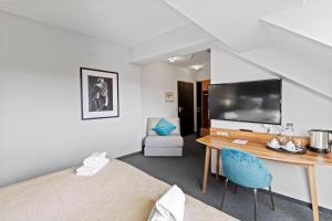 Łóżko lub łóżka w pokoju w obiekcie Hotel George Vienna