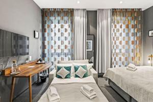 Łóżko lub łóżka w pokoju w obiekcie Hotel George Vienna