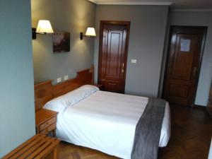 Ένα ή περισσότερα κρεβάτια σε δωμάτιο στο San telmo