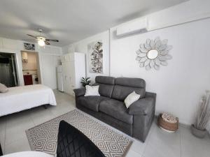 a living room with a couch and a bed at Beautiful Apartment in Almer a with Swimming Pool in Playas de Vera