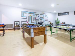 a room with two ping pong tables in it at Romantic apartment in Granada with shared pool in Granada