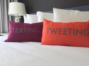 Postel nebo postele na pokoji v ubytování Hotel Lucent