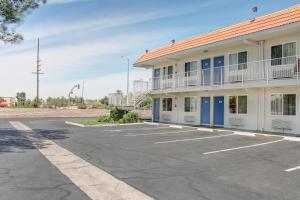 a parking lot in front of a building at Motel 6-Lancaster, CA in Lancaster