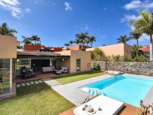 a house with a swimming pool in the yard at Holiday Home Maspalomas - LPA03100b-F in Maspalomas