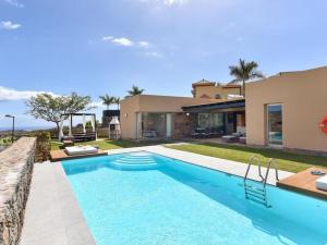a swimming pool in front of a house at Holiday Home Maspalomas - LPA03100b-F in Maspalomas