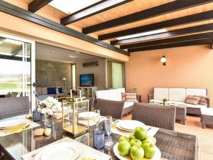 a dining room with a table with plates of food at Holiday Home Maspalomas - LPA03100b-F in Maspalomas