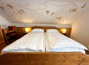 Postel nebo postele na pokoji v ubytování Locanda Orelli