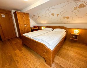 Postel nebo postele na pokoji v ubytování Locanda Orelli