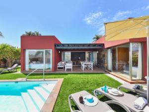 a house with a yard with a swimming pool at Holiday Home Maspalomas - LPA03100h-O in Maspalomas