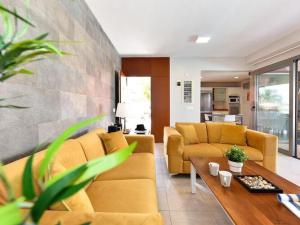a living room with two couches and a table at Holiday Home Maspalomas - LPA03100h-O in Maspalomas