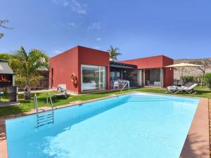a large swimming pool in front of a house at Holiday Home Maspalomas - LPA03100h-O in Maspalomas