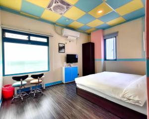 Postel nebo postele na pokoji v ubytování B&B of Blueshine