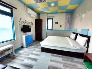 Postel nebo postele na pokoji v ubytování B&B of Blueshine