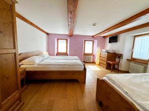 Postel nebo postele na pokoji v ubytování Locanda Orelli