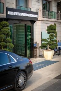 a black car parked in front of a building at MFB Tarabya Hotel in Istanbul