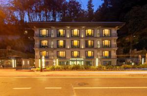 a building with lights on in front of a street at MFB Tarabya Hotel in Istanbul