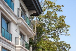 a building with a tree in front of it at MFB Tarabya Hotel in Istanbul