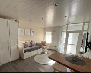 a living room with a couch and a table at MeerZeit in Kappeln