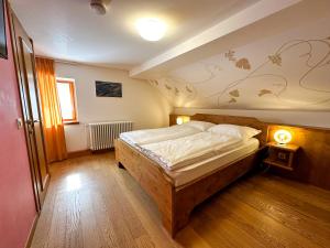 Postel nebo postele na pokoji v ubytování Locanda Orelli