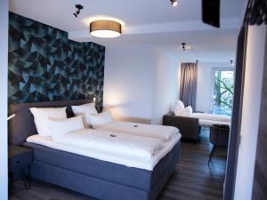 Postel nebo postele na pokoji v ubytování Hotel KUMP365