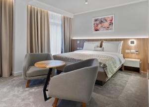 Postel nebo postele na pokoji v ubytování Hotel Podrinje