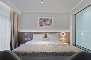 Postel nebo postele na pokoji v ubytování Hotel Podrinje