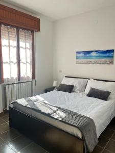 a bedroom with a large bed in a room at Holiday home in La Maddalena