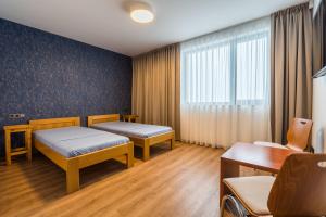 Postel nebo postele na pokoji v ubytování Adalbert penzion Čejkovice