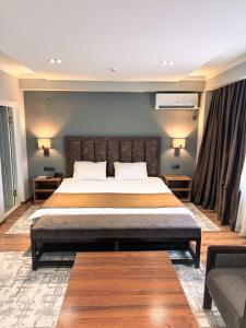 Кровать или кровати в номере Ziyorat Luxury Hotel