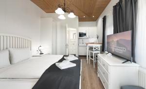 Posteľ alebo postele v izbe v ubytovaní Provence Apartmanok