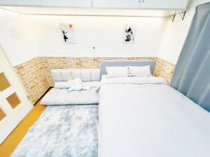 Ein Bett oder Betten in einem Zimmer der Unterkunft Ikebukuro Sugamo 205
