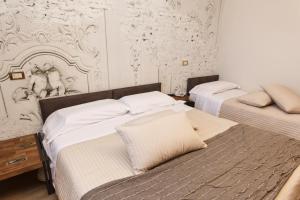Postel nebo postele na pokoji v ubytování AgriHotel Villa Ambra