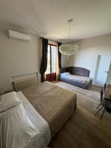 Postel nebo postele na pokoji v ubytování AgriHotel Villa Ambra
