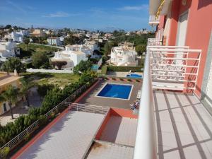 a view from the balcony of a house with a swimming pool at 3Z Brisa Mar - Casas & Papéis in Armação de Pêra