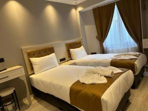 Postel nebo postele na pokoji v ubytování Sareban Hotel Istanbul