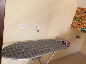 a table in the corner of a room with two outlets at Bahria Villa in Karachi