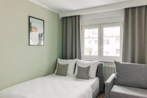 Χώρος καθιστικού στο Homaris Apartments Frankfurt