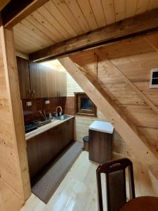 an overhead view of a kitchen in a log cabin at Sicevacka Bajka in Niš