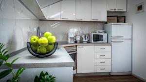 Kuchyň nebo kuchyňský kout v ubytování Apartments Mariana