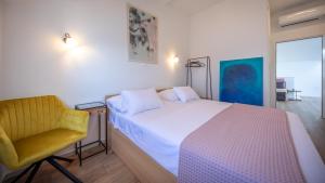 Postel nebo postele na pokoji v ubytování Apartments Mariana