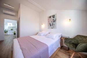 Postel nebo postele na pokoji v ubytování Apartments Mariana