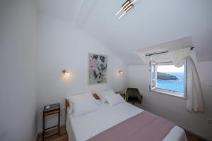 Postel nebo postele na pokoji v ubytování Apartments Mariana