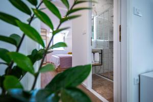 Postel nebo postele na pokoji v ubytování Apartments Mariana