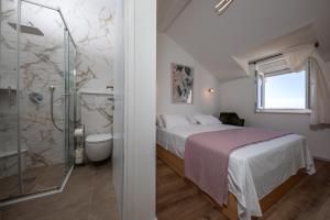 Postel nebo postele na pokoji v ubytování Apartments Mariana