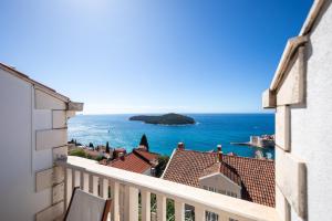 a view of the ocean from a balcony at Apartments Mariana in Dubrovnik