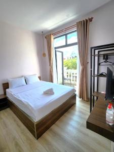 Кровать или кровати в номере Lana Inn - Grand World Phú Quốc