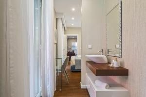 a bathroom with a sink and a mirror at Quinta da Tia Briosa by Madeira Sun Travel in Ponta do Sol