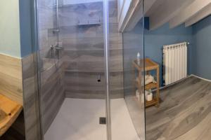 a shower with a glass door in a bathroom at La dolce vita al lago in Bogliaco +12 photos
